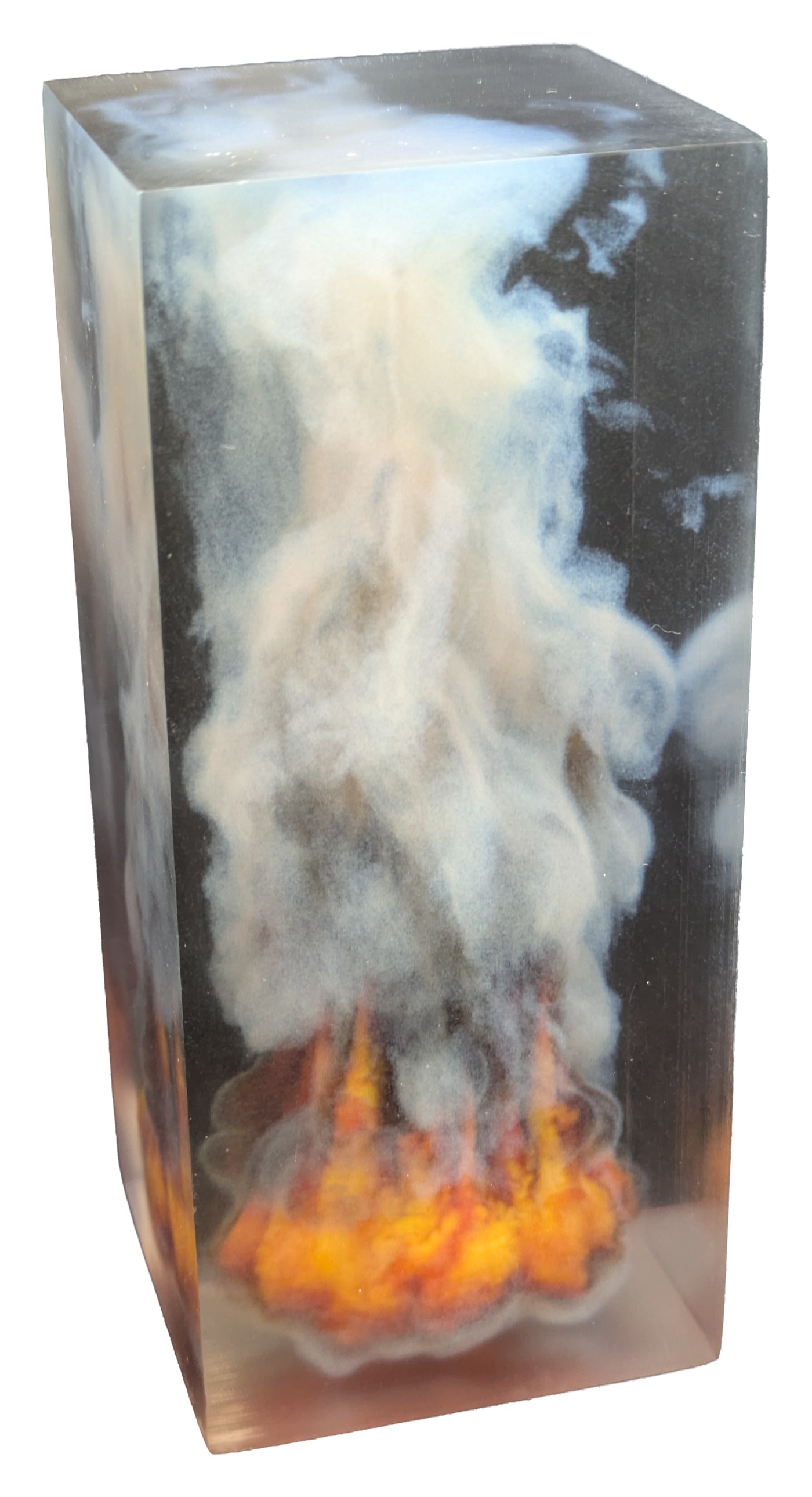 Photograph of a clear rectangular print containing orange flames at the base and white smoke rising above them.